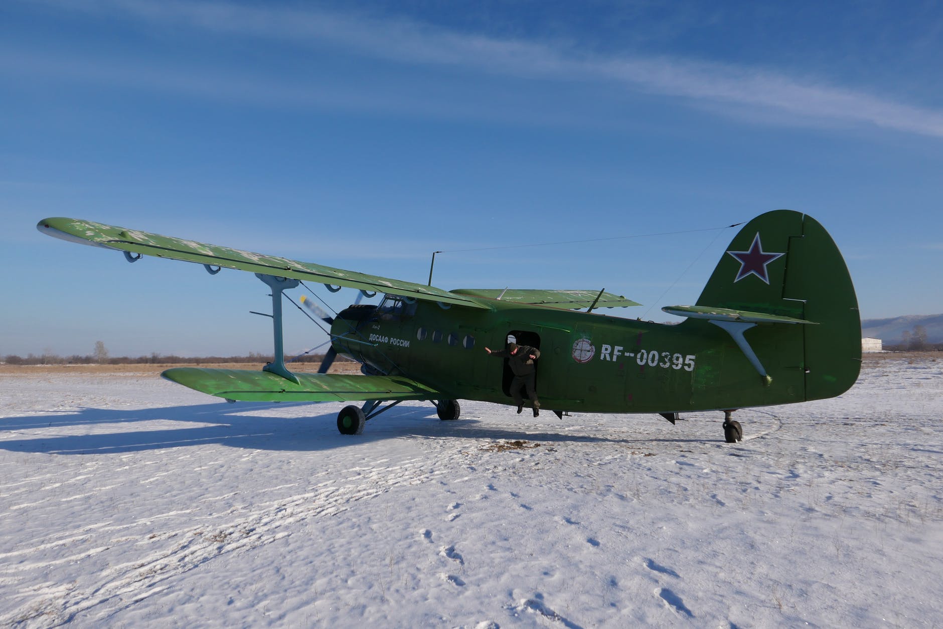 biplane on snowy ground in nature